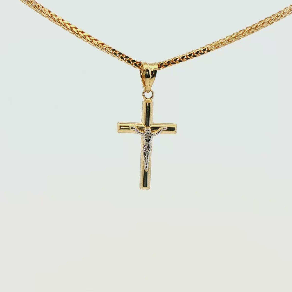 CRUZ DE ORO 14K CON FIGURA EN ORO BLANCO