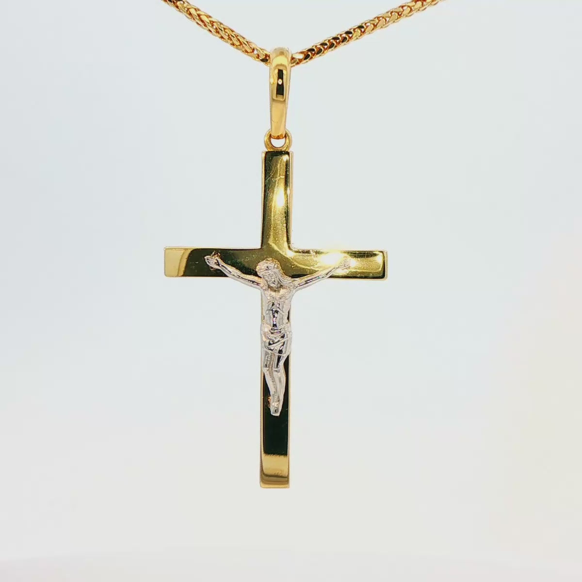 DIJE DE CRUZ EN ORO DE 14K CON FIGURA EN ORO BLANCO